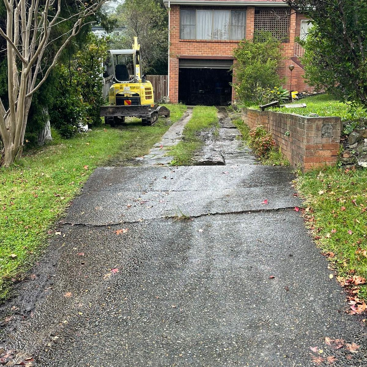Exposed aggregate concrete driveway in Cromer showing natural stone blend